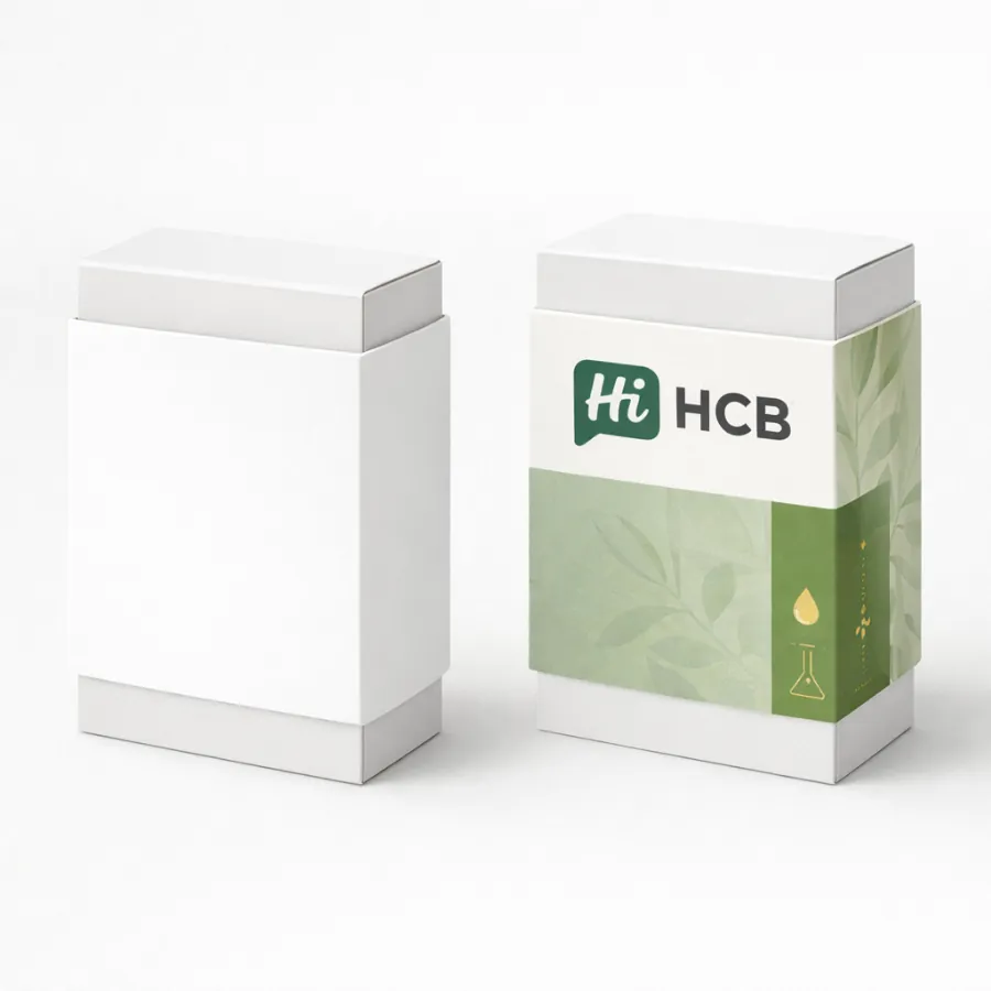 Two white rectangular boxes with custom-fitted sleeves- one blank and one featuring a green leaf design- class=